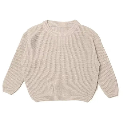 Beige knitted sweater on a white background