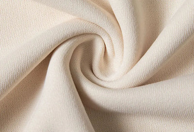 Close-up of beige fabric with a soft texture