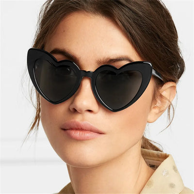 Stylish heart-shaped sunglasses in black on girl