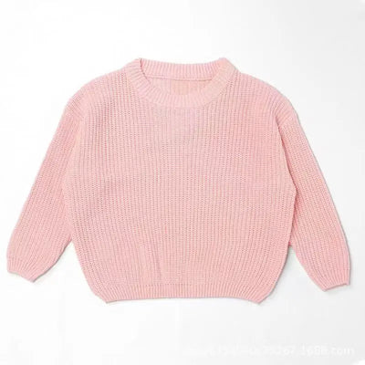 Pink sweater on a white background