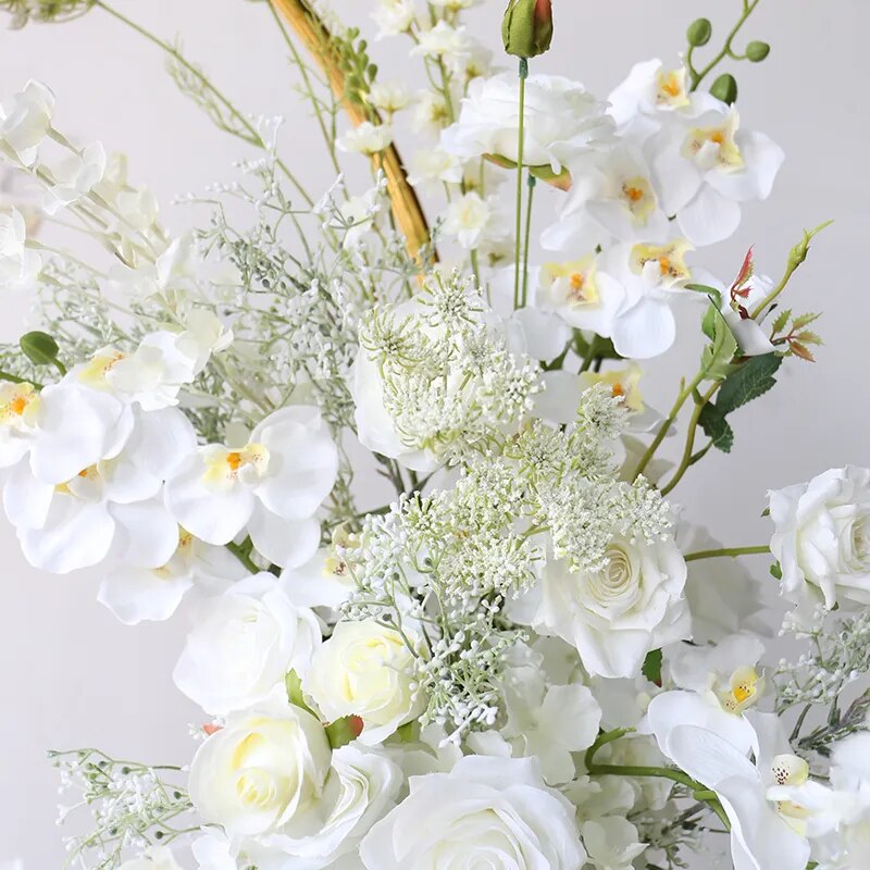 Artificial floral arrangements with white orchid and roses