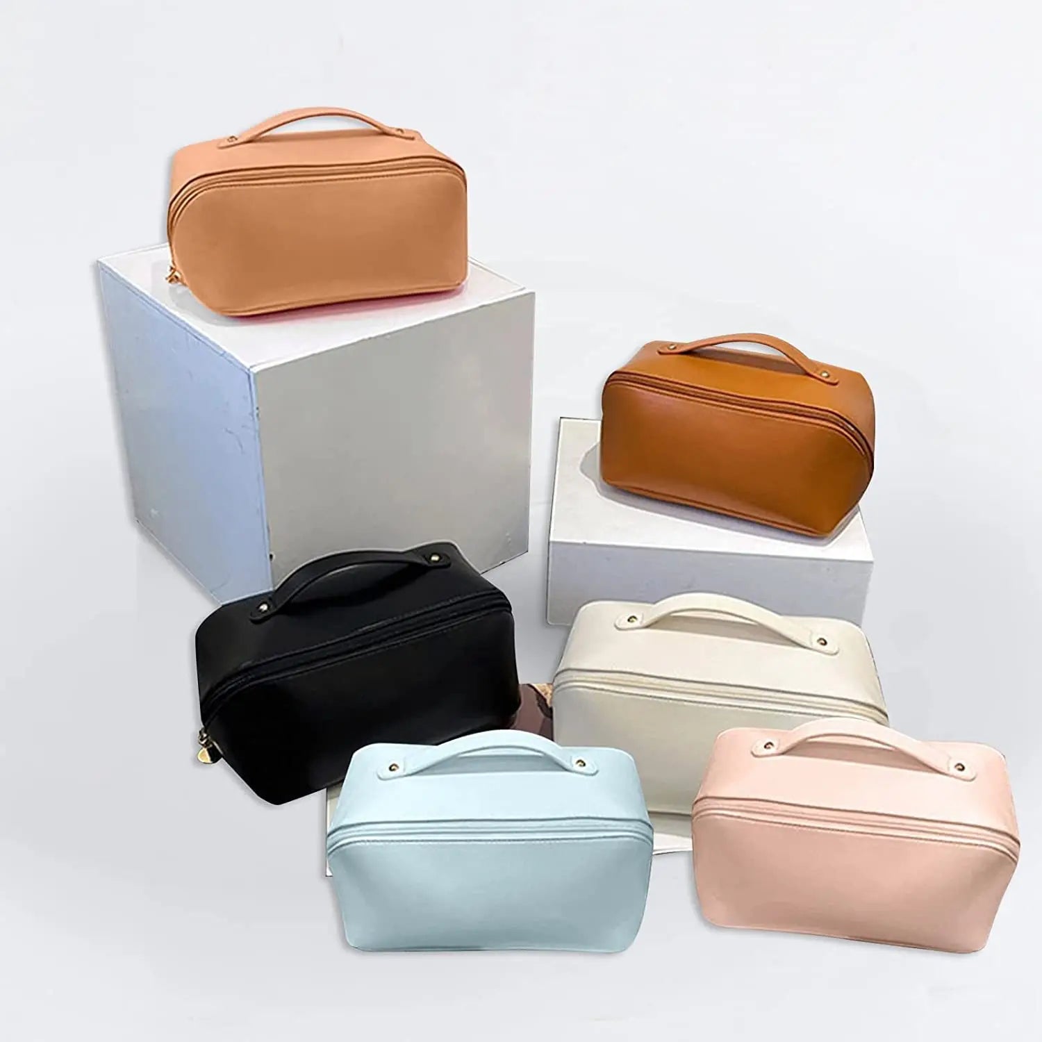 Set of six colorful cosmetic bags on a white background